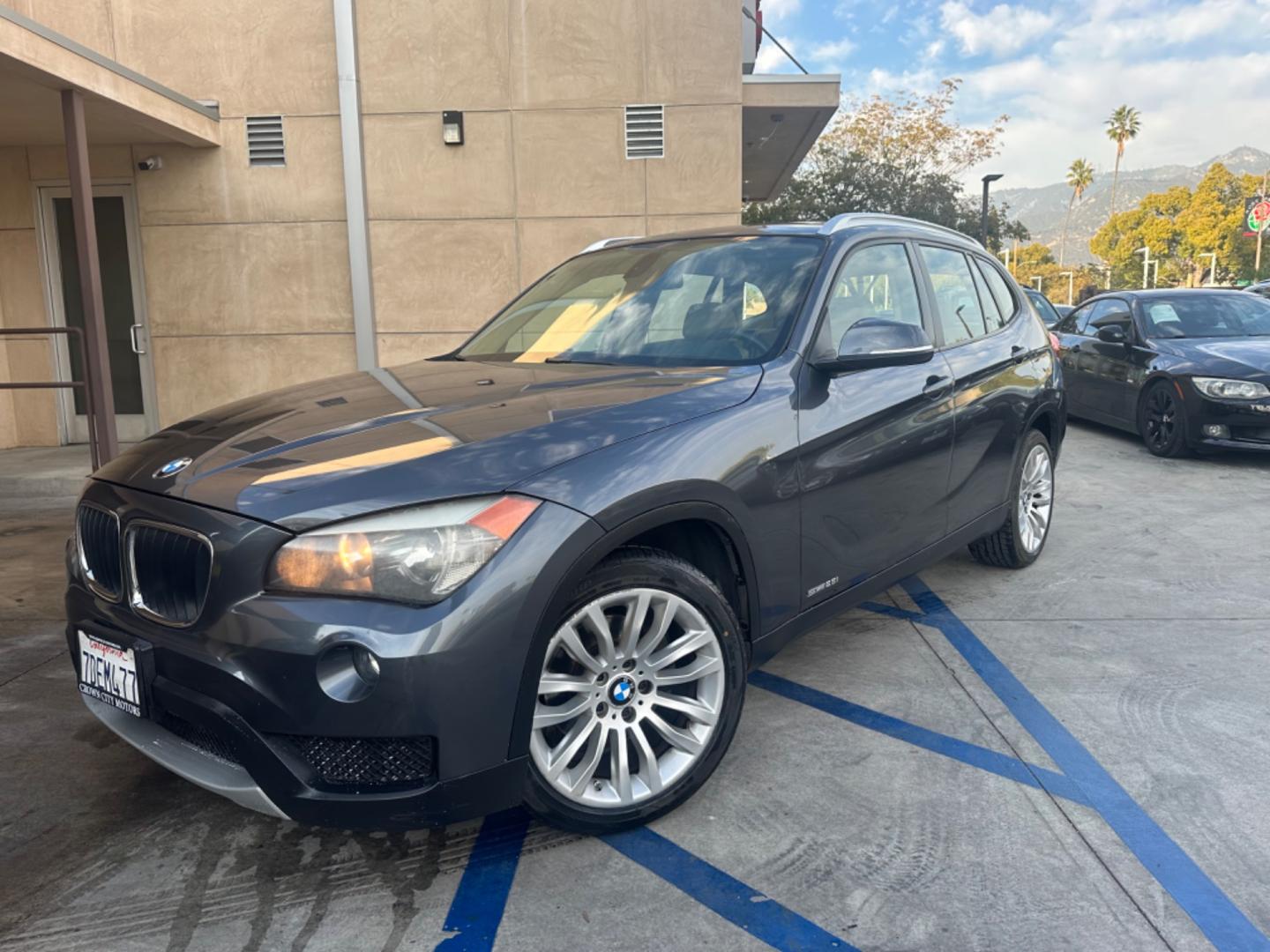 2014 Gray /black BMW X1 leather (WBAVM1C58EV) with an 4 CYLINDER engine, Automatic transmission, located at 30 S. Berkeley Avenue, Pasadena, CA, 91107, (626) 248-7567, 34.145447, -118.109398 - Experience Luxury and Power: 2014 BMW X1 2.0 4-Cylinder Turbo with Panoramic Roof - Available Now in Pasadena, CA Elevate your driving experience with the sophisticated 2014 BMW X1 2.0 4-Cylinder Turbo, featuring a stunning panoramic roof. This exquisite pre-owned luxury SUV is now available at o - Photo#0